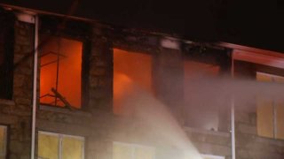 Firefighters in Fall River, Massachusetts respond to an early morning blaze Monday, Jan. 12, 2020 at a mill building.