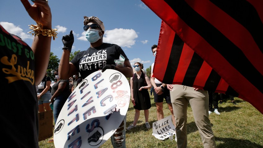 People participate in a Juneteenth rally, Friday, June 19, 2020, in Boston. Juneteenth commemorates when the last enslaved African Americans learned in 1865 they were free, more than two years following the Emancipation Proclamation.