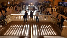 NEW YORK, NY - OCTOBER 28: Commuters make their way through Grand Central Terminal as the sun rises through the east facade on October 28, 2019 in New York City. (Photo by Gary Hershorn/Corbis via Getty Images)