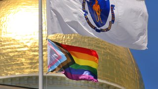 A new transgender flag is hoisted at the Massachusetts State House in Boston