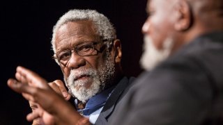 Bill Russell looks on as Dr. Harry Edwards asks him how he felt about students getting paid for sports while in college on the second day of the Civil Rights Summit at the LBJ Presidential Library in Austin, Texas, on April 9, 2014.