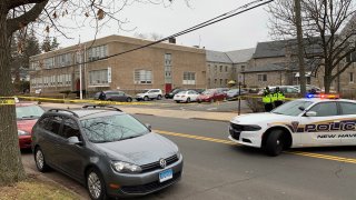 police block off alden avenue in New Haven after a shooting