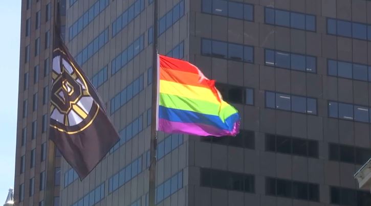 boston pride 2019 pride flag and bruins flag at city hall