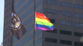 boston pride 2019 pride flag and bruins flag at city hall
