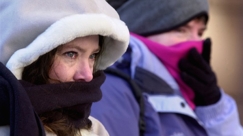 BOSTON, MA – JANUARY 15: Two heavily clad women brace themselves against the bitter cold on Newbury Street January 15, 2004 in Boston, Massachusetts. New England is experiencing one of the most severe cold snaps in recent memory, with a frigid arctic air mass coming in from central Canada and the North Pole. (Photo by Michael Springer/Getty Images)