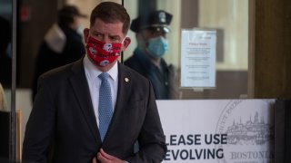 Boston Mayor Marty Walsh wears a Patriots mask amid the coronavirus crisis
