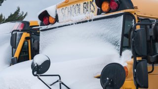 School Bus Covered in Snow