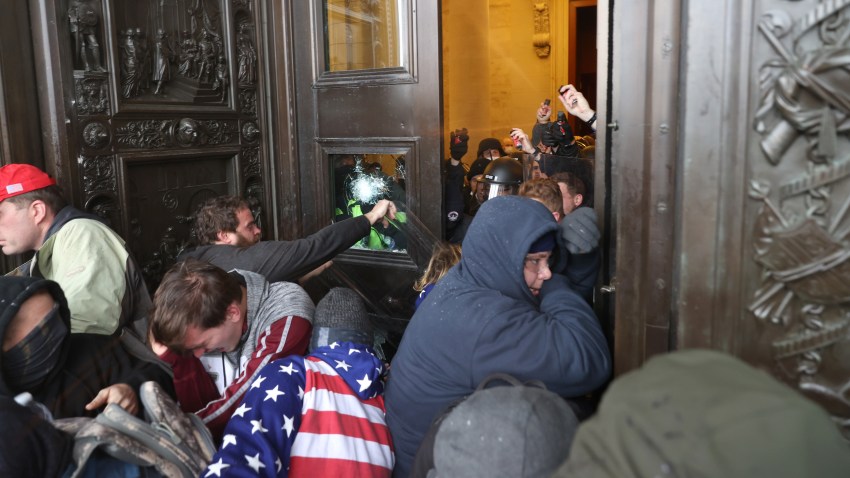 Protesters attempt to enter the U.S. Capitol building