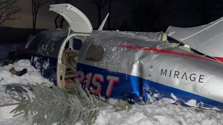 A crashed plane in Leicester, Massachusetts, on Tuesday, Feb. 2, 2021.