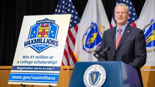 This June 15, 2021, photo shows Massachusetts Gov. Charlie Baker announces the Massachusetts VaxMillions Giveaway for residents who are fully vaccinated against COVID-19.