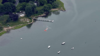 A U.S. Coast Guard helicopter searching for a woman who may have gone missing in Hingham Harbor Thursday.