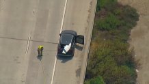 It appears a piece of the aircraft landed on a car on the freeway,