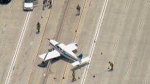 Aerial image shows first responders at the scene of the plane landing.