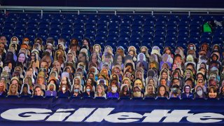 cardboard cutouts of fans in the stands at Gillette Stadium