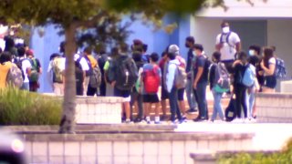 Students outside a school.