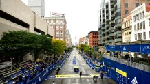 BOSTON, MASSACHUSETTS - OCTOBER 11: Marcel Hug of Switzerland crosses the finish line to win the men's wheelchair race during the 125th Boston Marathon on October 11, 2021 in Boston, Massachusetts. (Photo by Maddie Malhotra/Getty Images)