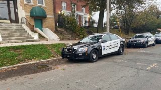 Hartford police crusiers parked outside apartment buildings