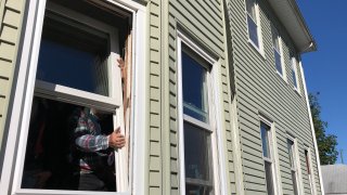 Volunteer contractors replacing windows in Hartford, Connecticut
