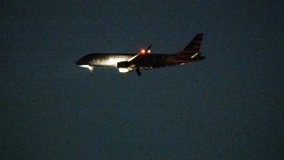 A plane landing at Boston Logan International Airport