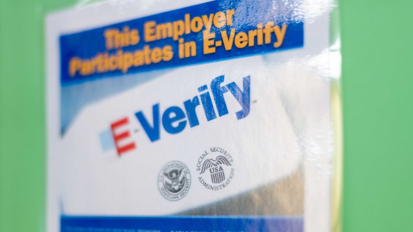 Fairfax, USA – September 29, 2018: Job Everify employer regulations sign on board post poster information in Virginia office