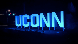 UConn sign at night