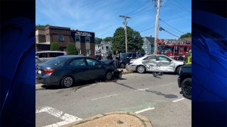 The scene in Dorchester on Tuesday, June 14, 2022, after Massachusetts State Police arrested a man in a ski mask who led them on a chase in a vehicle connected to a recent carjacking.