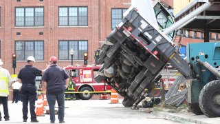 A crane that fell onto a building under construction in Boston's Dorchester neighborhood on Tuesday, July 26, 2022.