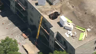 The hole left in an apartment building's roof in a partial collapse on Friday, July 15, 2022.