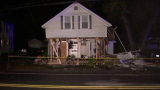 Damage left after car crashes into home