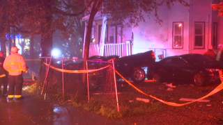 A car crashes into the front of a home in Mattapan