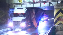 Truck gets stuck under overpass in Boston, Massachusetts
