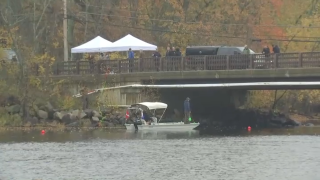 An underwater search crew on the Concord River