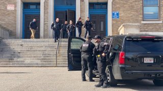 Police at Excel High School in South Boston Friday, Oct. 28, 2022.