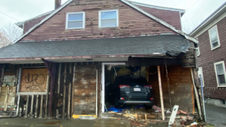 An SUV that drove into a vacant home Friday