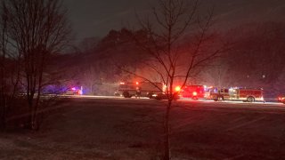 Authorities at the scene of a crash on I-295 near Smithfield and Lincoln, Rhode Island, on Sunday, Dec. 12, 2022.