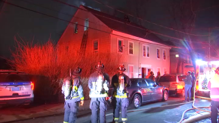 Pictured are firefighters on scene of a duplex fire in Mattapan