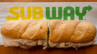 A Subway sandwich is seen on a table at a Subway restaurant, Jan. 12, 2023, in Austin, Texas. Subway has reportedly begun exploring a sale which could value the sandwich chain at more than $10 billion.