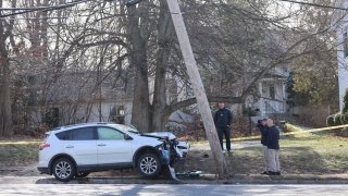 A damaged SUV at the scene of a crash in Needham, Massachusetts, that sent a pedestrian to the hospital on Thursday, Feb. 2, 2023.