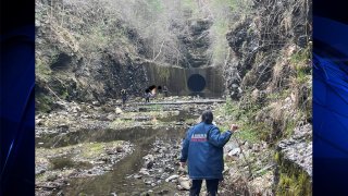 A group of teenagers is rescued from a flood control tunnel in Auburn, Massachusetts, on Sunday, April 16, 2023.