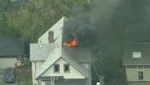A fire burning at a Watertown, Massachusetts, home on Thursday, May 11, 2023.