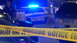Boston police tape across a crime scene