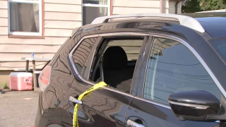 An SUV with a shattered window at the scene of a deadly shooting in Lynn, Massachusetts, as seen on Saturday, Sept. 2, 2023.