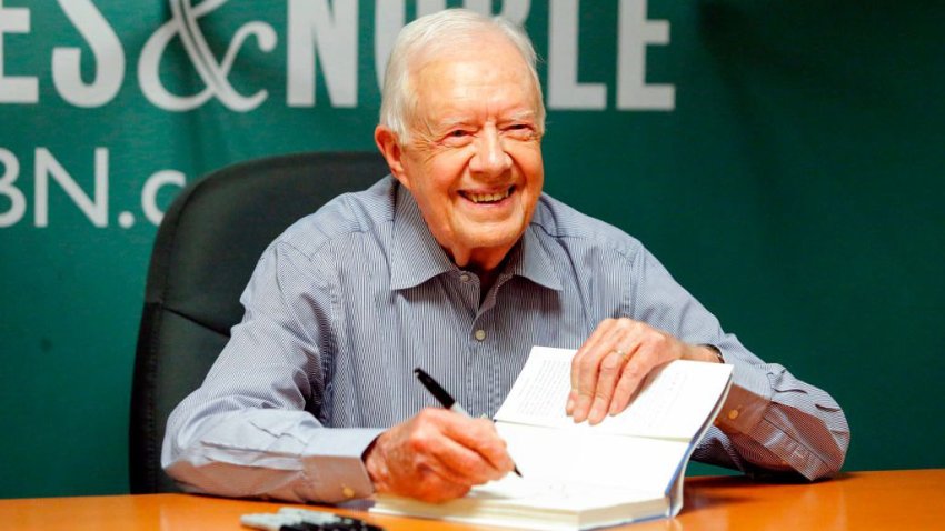 Former US President Jimmy Carter signs his new Book “A Full Life: Reflections at Ninety” at Barnes & Noble on 5th avenue in New York on July 7, 2015. PHOTO/ KENA BETANCUR (Photo by KENA BETANCUR / AFP) (Photo by KENA BETANCUR/AFP via Getty Images)