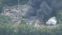 A fire burning at a scrap yard in Billerica, Massachusetts, on Friday, Sept. 15, 2023.