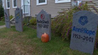 Tombstones with logos of businesses that dont exist anymore