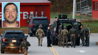 Law enforcement officials load into a tactical vehicle at Lisbon High School in Lisbon, Maine, at daybreak on Thursday, Oct. 26, 2023, amid the search for the suspected gunman, Robert Card (seen inset), in deadly mass shootings in Lewiston on Wednesday evening.