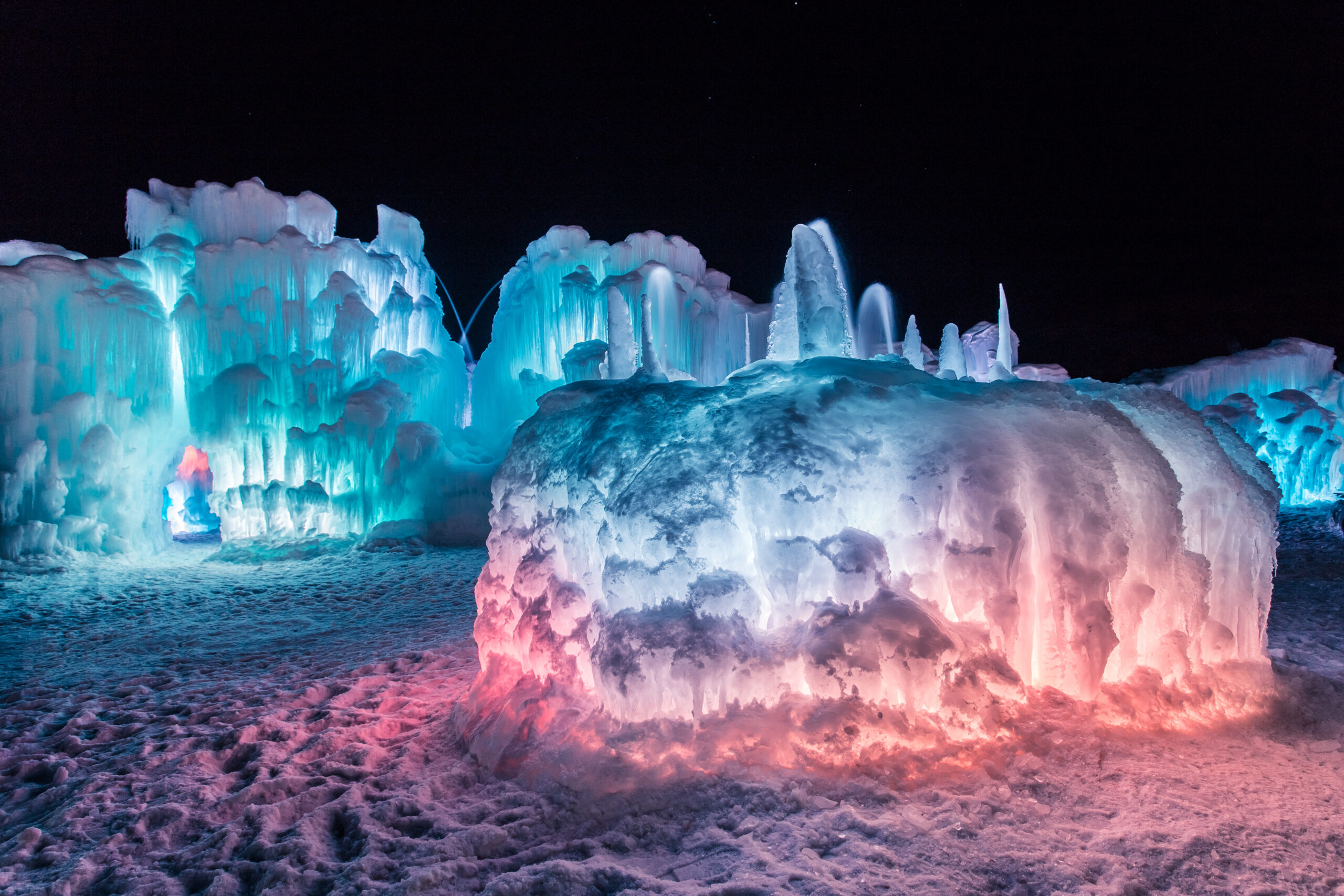 Ice Castles illuminated at night. The New Hampshire Ice Castles are set to open Jan. 20.
