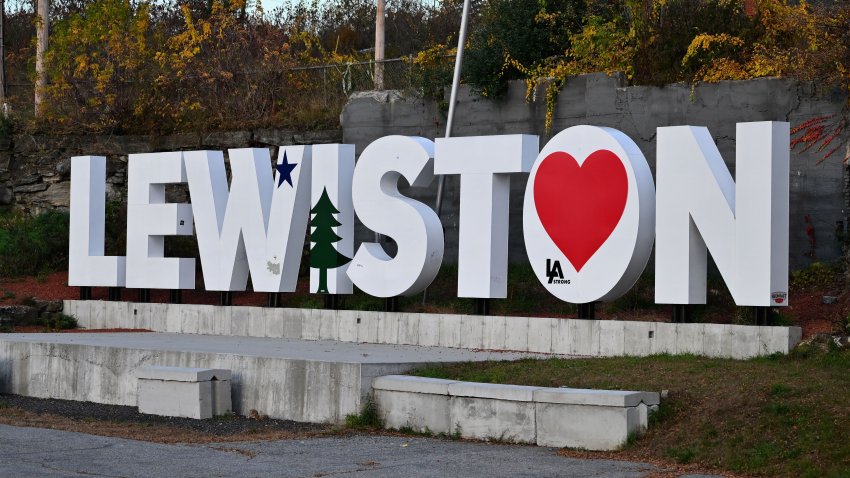 TOPSHOT – The Lewiston, Maine, city sign is seen with a heart on October 27, 2023, in the aftermath of a mass shooting. Police in Maine struggled for a second day on October 27, 2023, to catch a man who gunned down 18 people with a semi-automatic rifle in a bowling alley and a bar in a town where locals were enjoying an evening out. Robert Card, 40, is accused of being the man seen on security cameras walking into a Lewiston bowling alley on the evening of October 25, 2023, and launching the country’s deadliest mass shooting of the year so far. In addition to the 18 murdered at the bowling venue and later in a bar, the US Army reservist is accused of wounding 13. (Photo by ANGELA WEISS / AFP) (Photo by ANGELA WEISS/AFP via Getty Images)