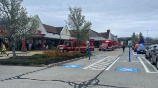 First responders at a shopping plaza in Warwick, Rhode Island, where at least nine people where sickened Thursday, April 18, 2024.