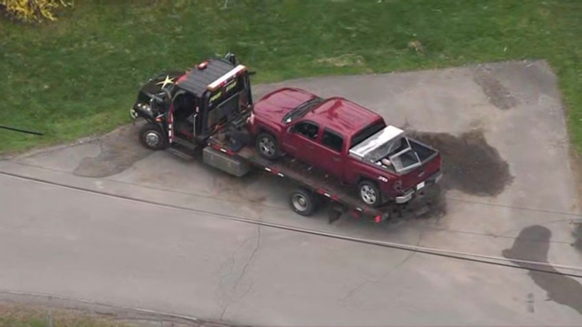 The driver of this red pickup truck is accused of leading police on a chase through multiple towns while high on methamphetamine.